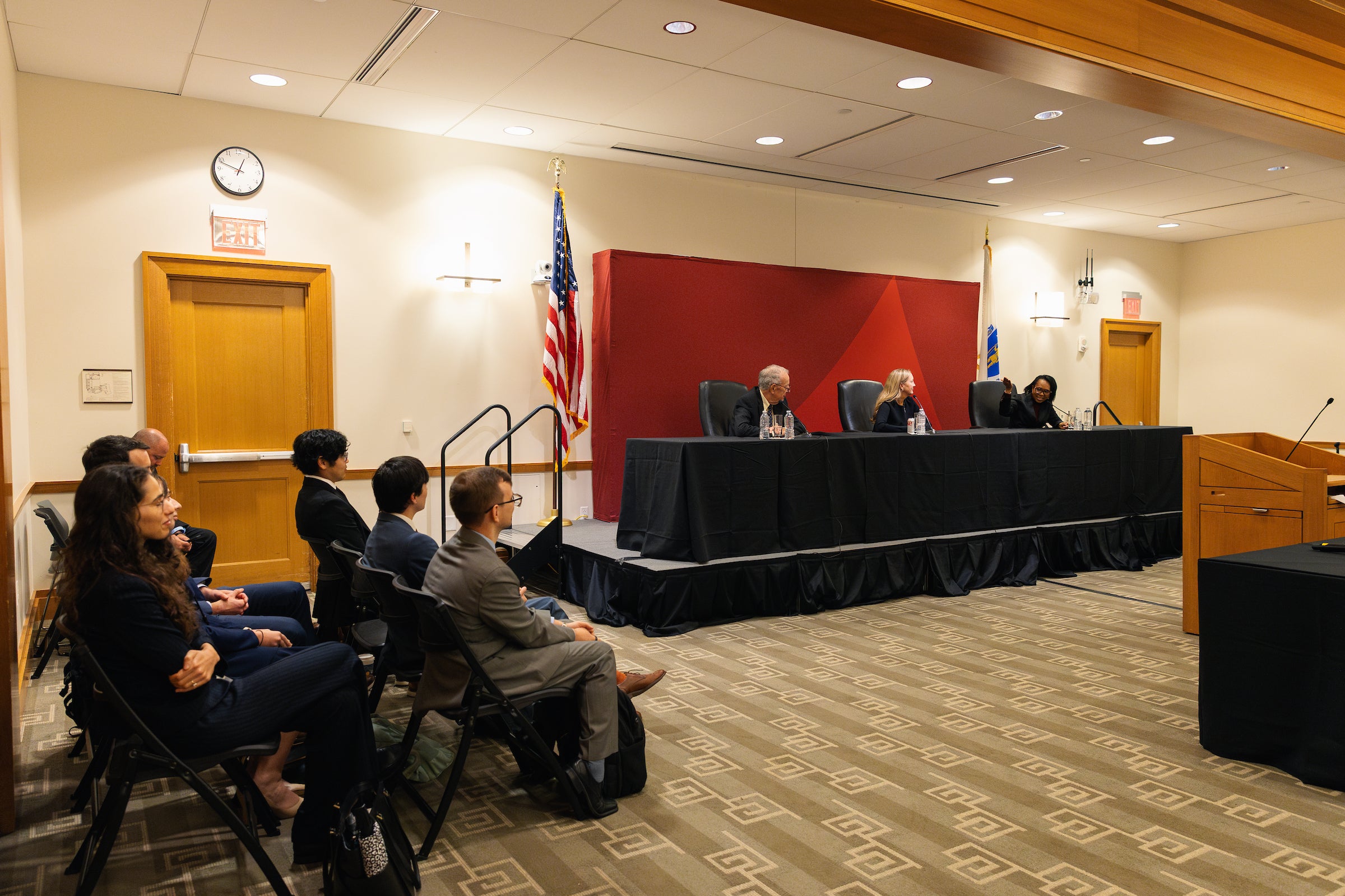 Circuit court clerks observe the panel of judges as they answer questions.