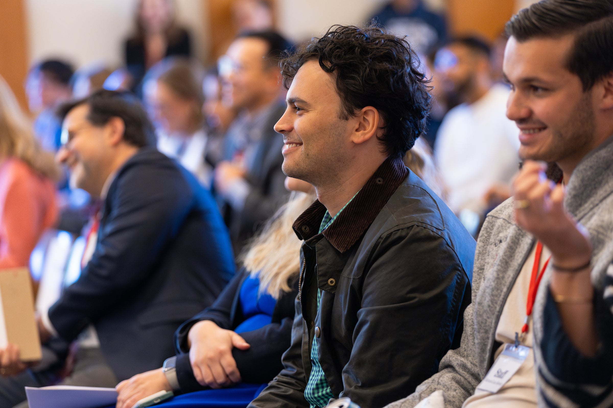 An audience member smiles.