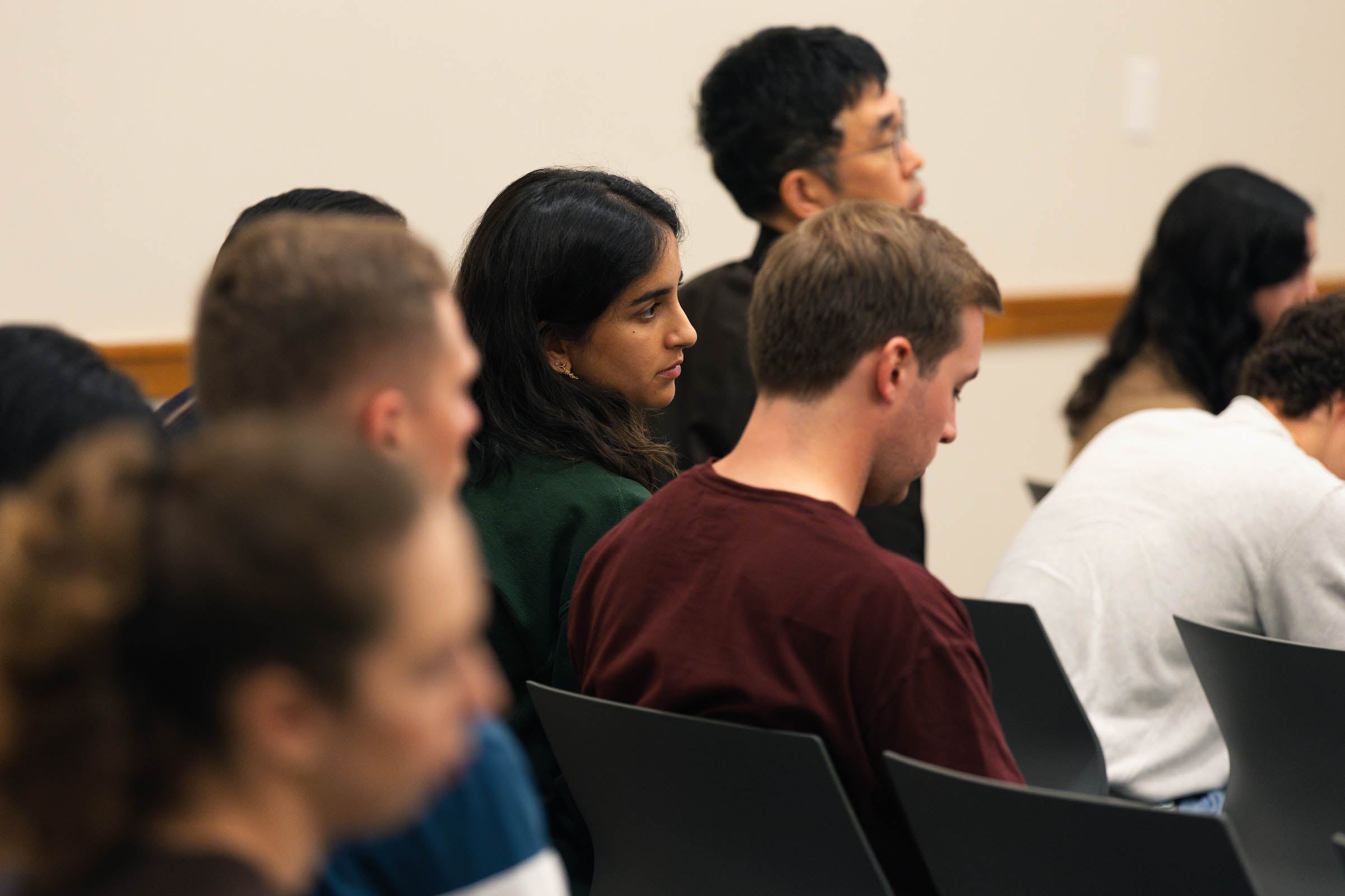 An audience member listens intently.