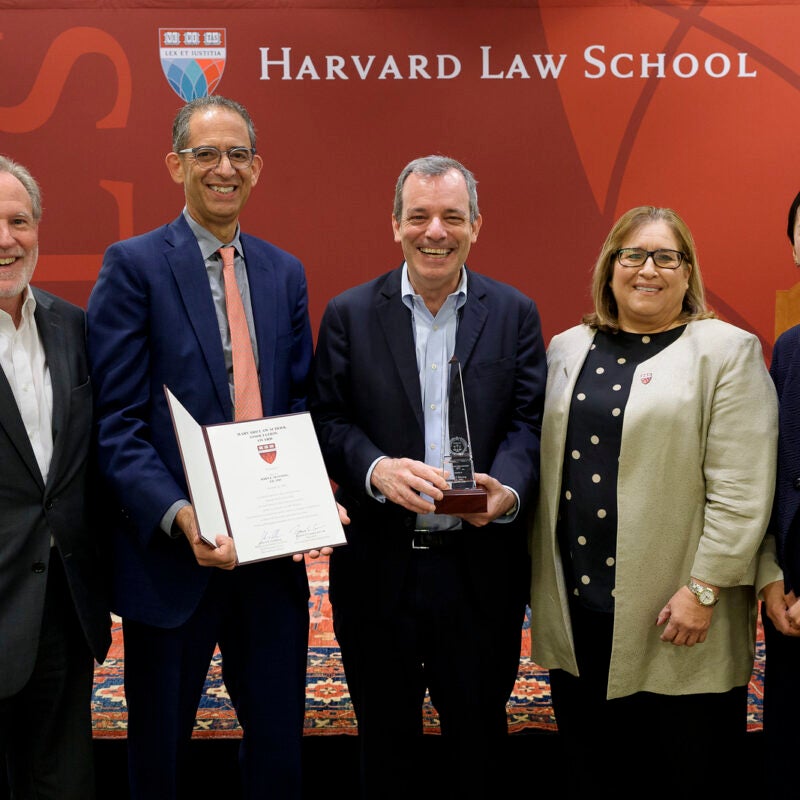 Dean John C.P. Goldberg posing with recipient of HLSA award and others