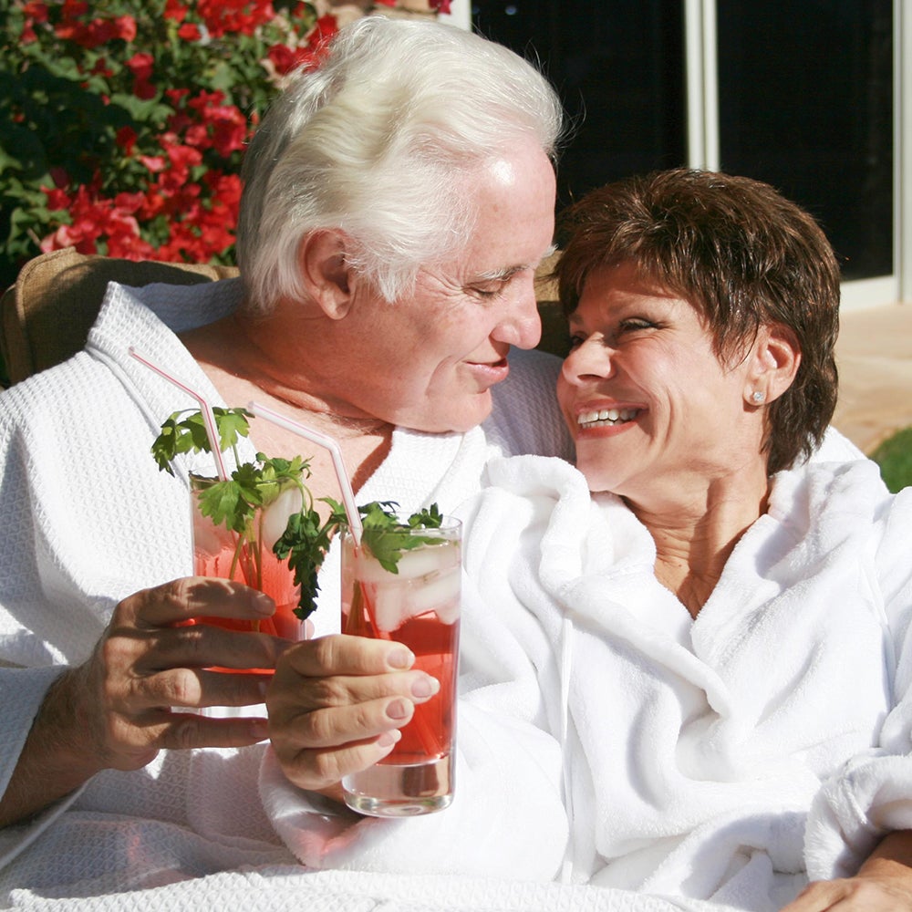 Wayne and Lucia Howard enjoying mocktails in the backyard.