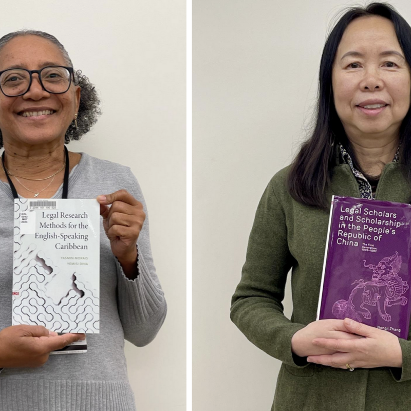 Yasmin Morais and Nongji Zhang holding books they authored.