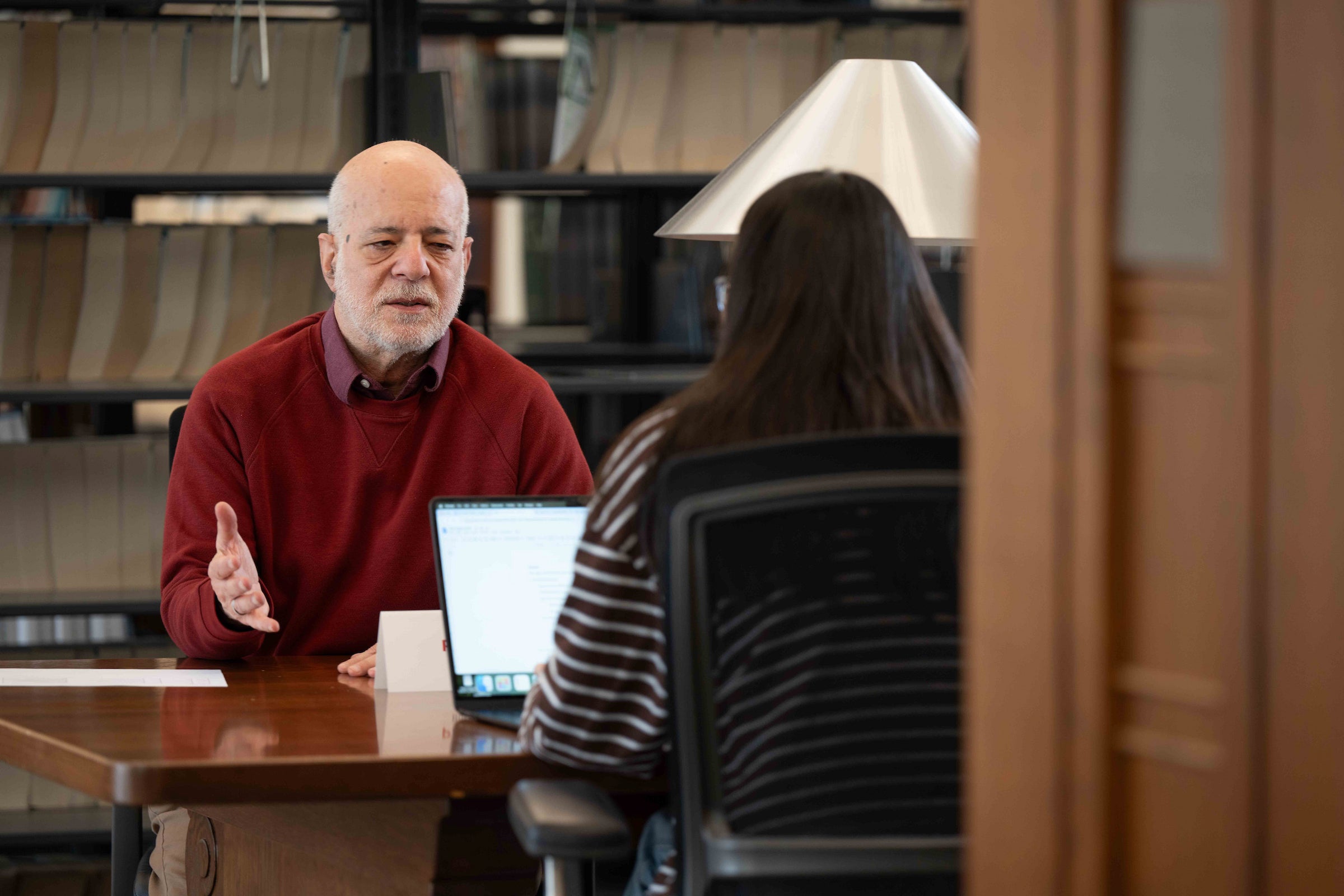 Joseph Singer provides feedback to a student.