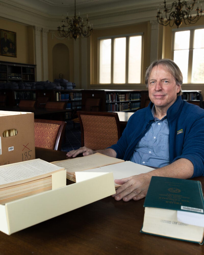 Paul Deschner at a table with Nuremberg files.