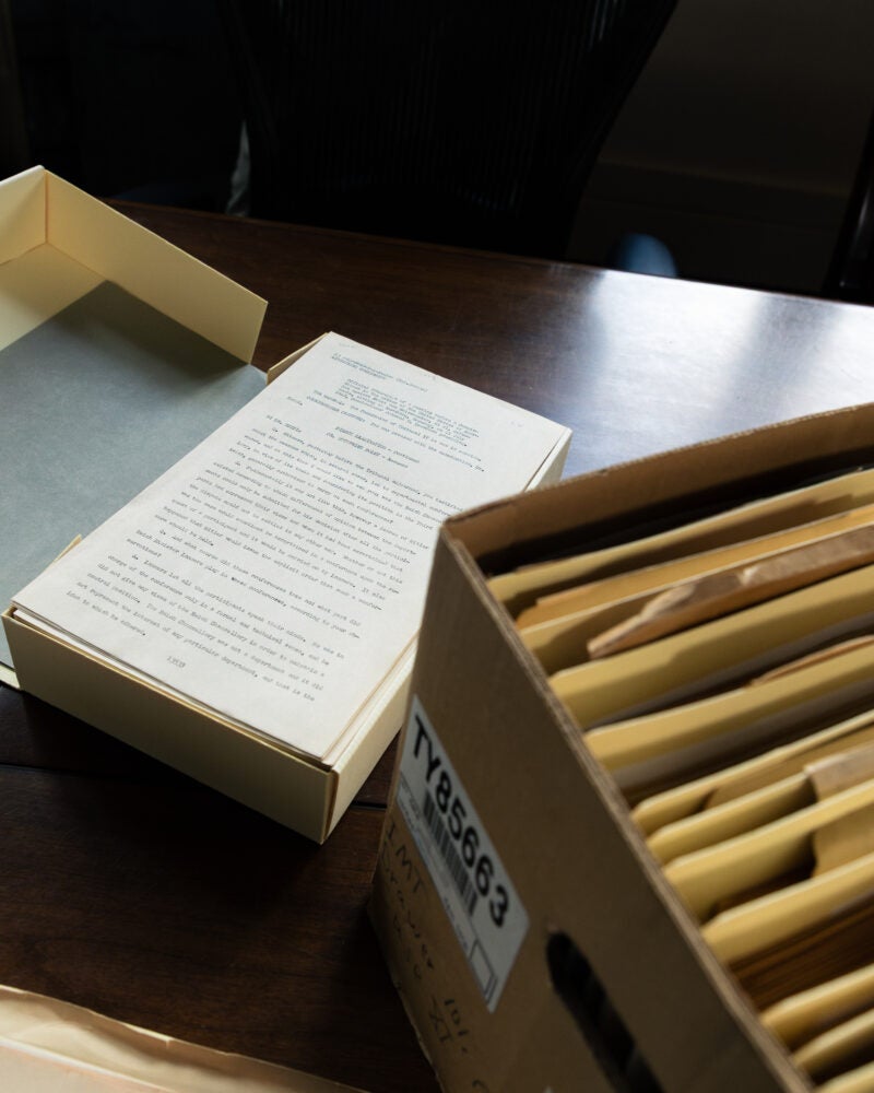 Box of paper transcripts from Nuremberg trials.