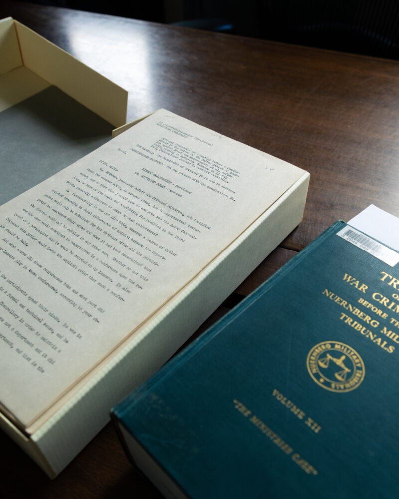 Box of paper transcripts from Nuremberg trials.