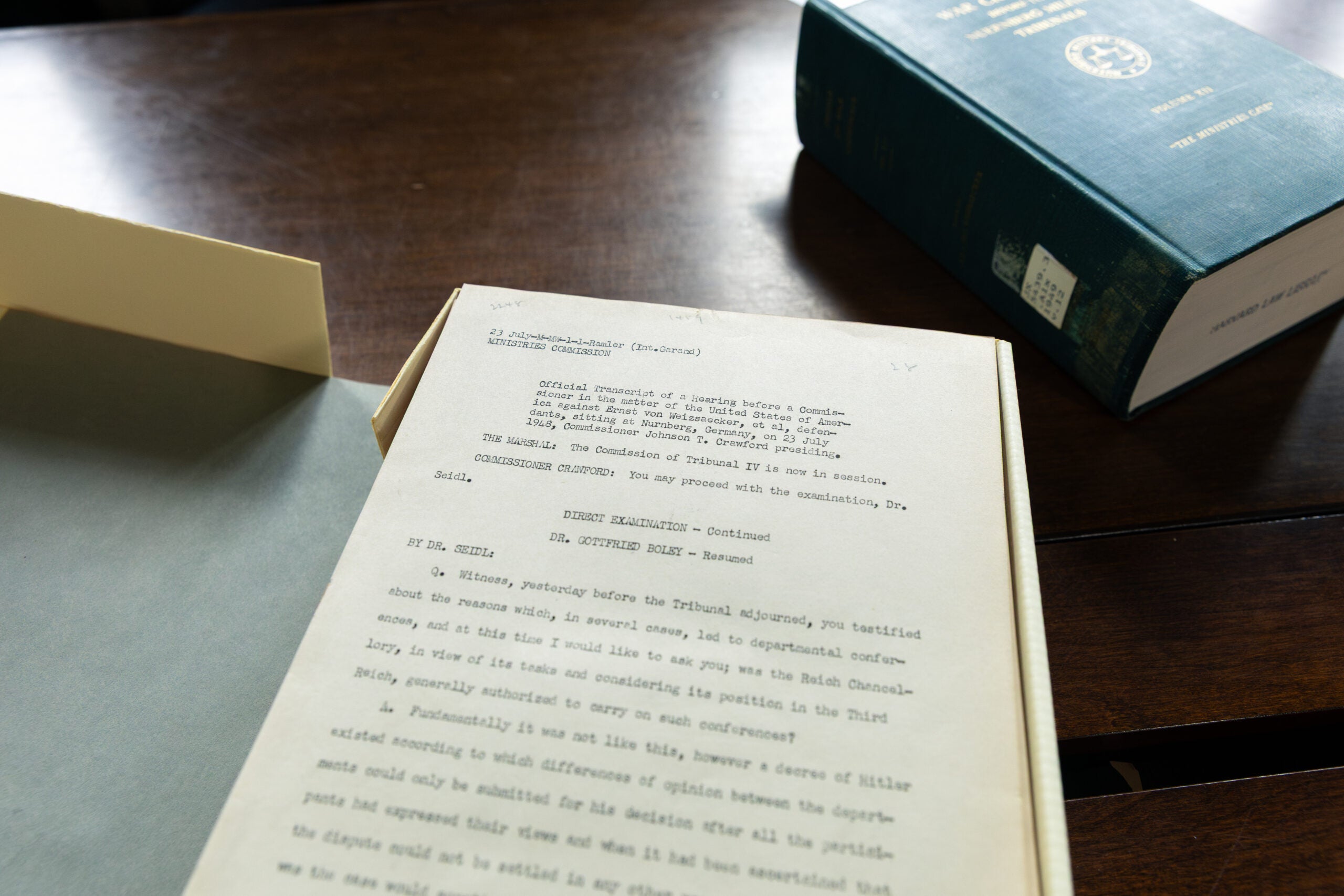 Box of paper transcripts from Nuremberg trials.