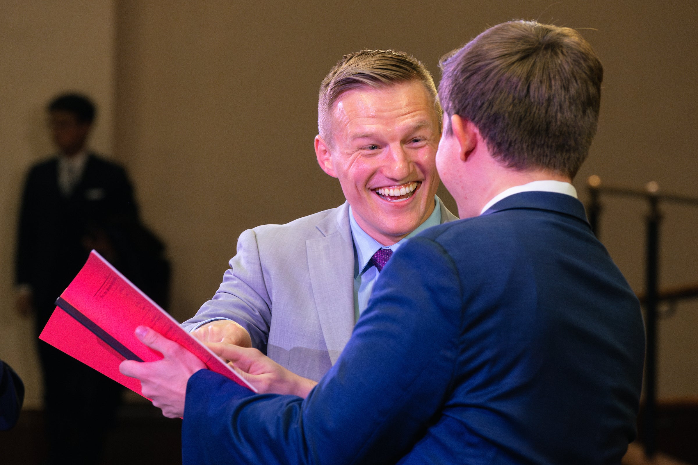 A proud moment between a parent and a son who participated in Ames.