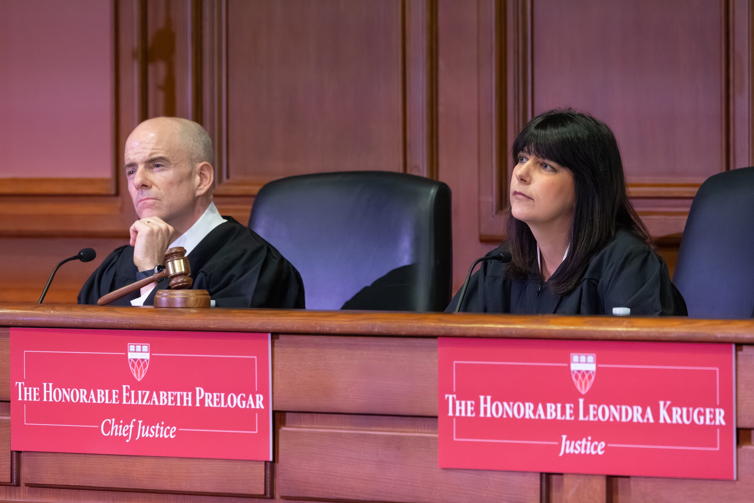 Two judges on a panel.