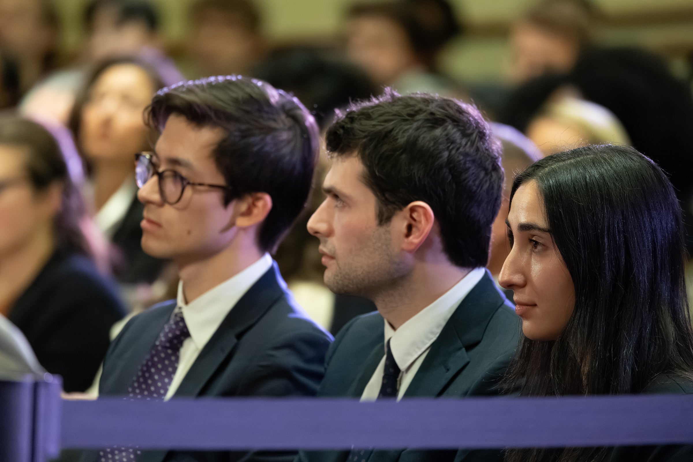 Students sitting in an audience.