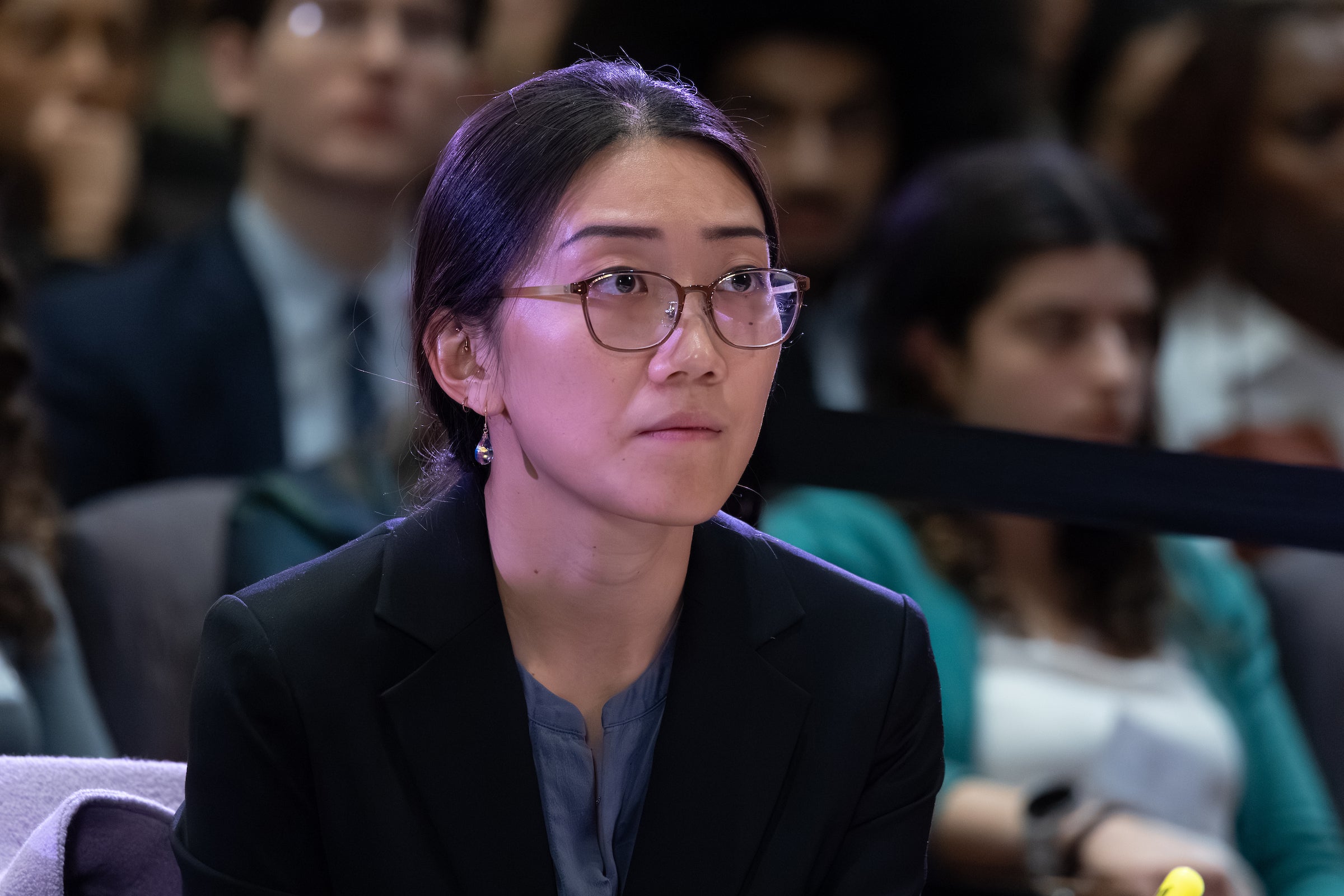A close up of a woman with a pensive expression.