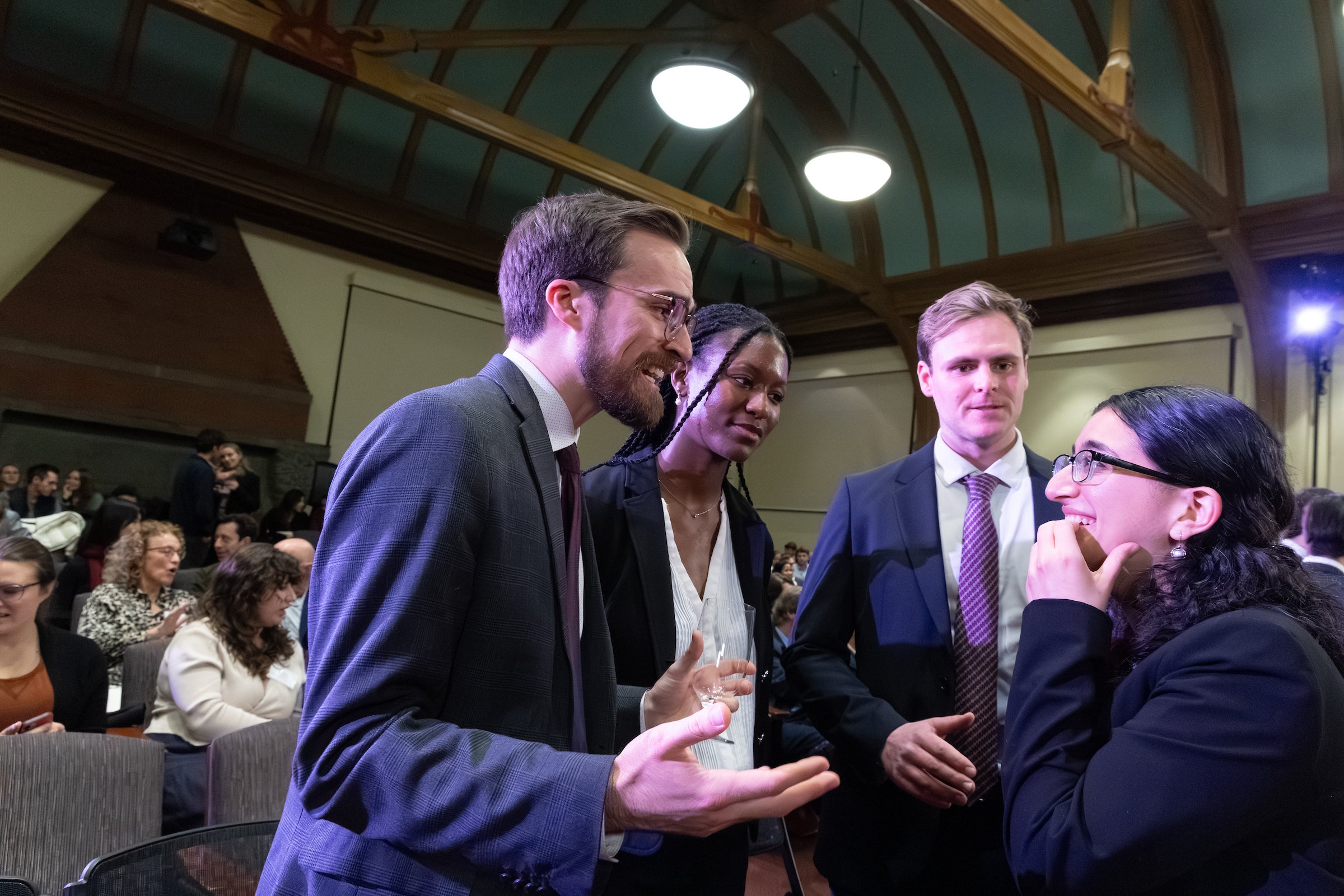 A group of students share excitement as they gather.