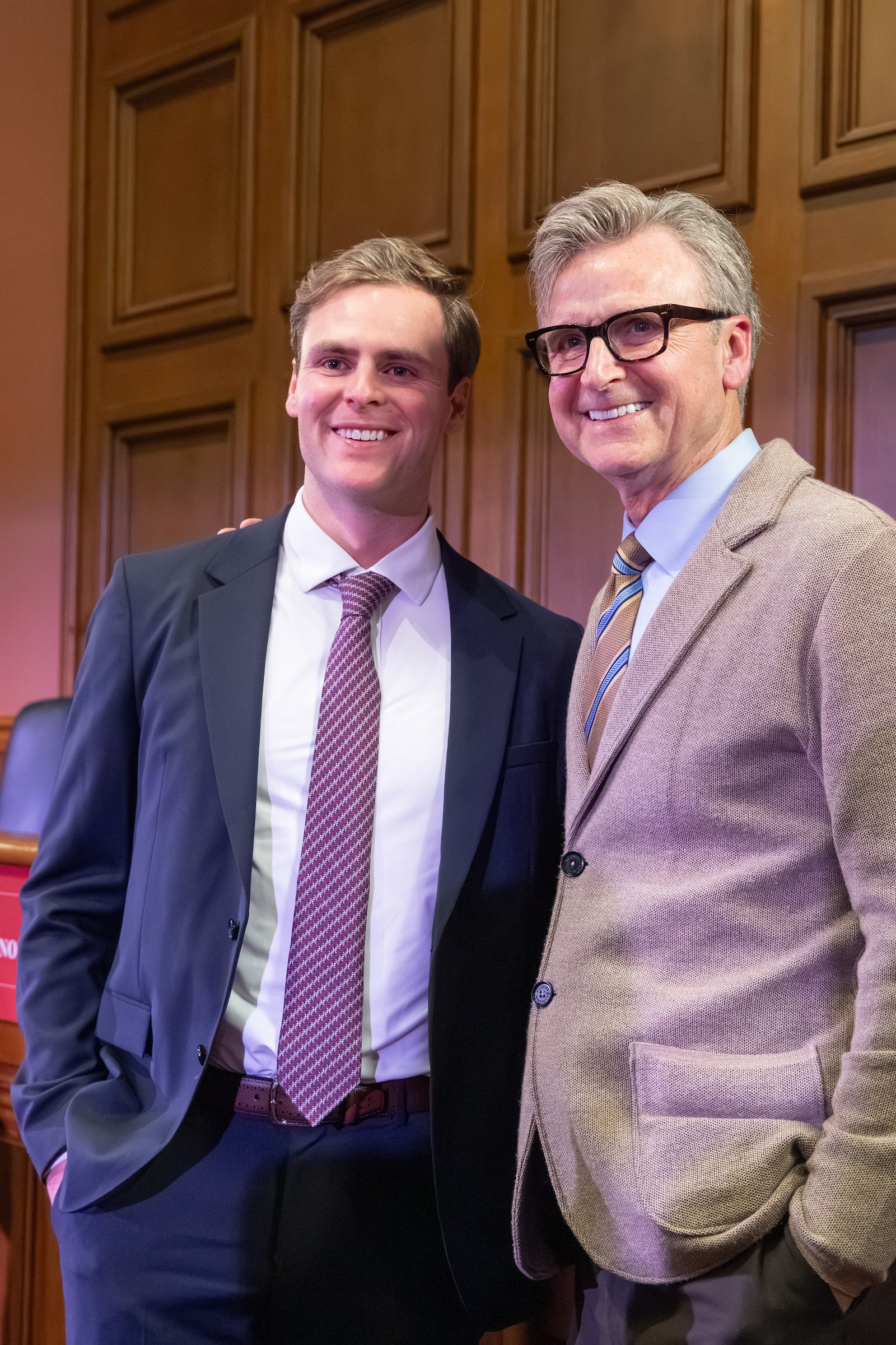 A family member proudly poses with an Ames team member.