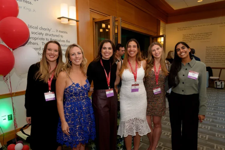 Alumni posing for a picture together