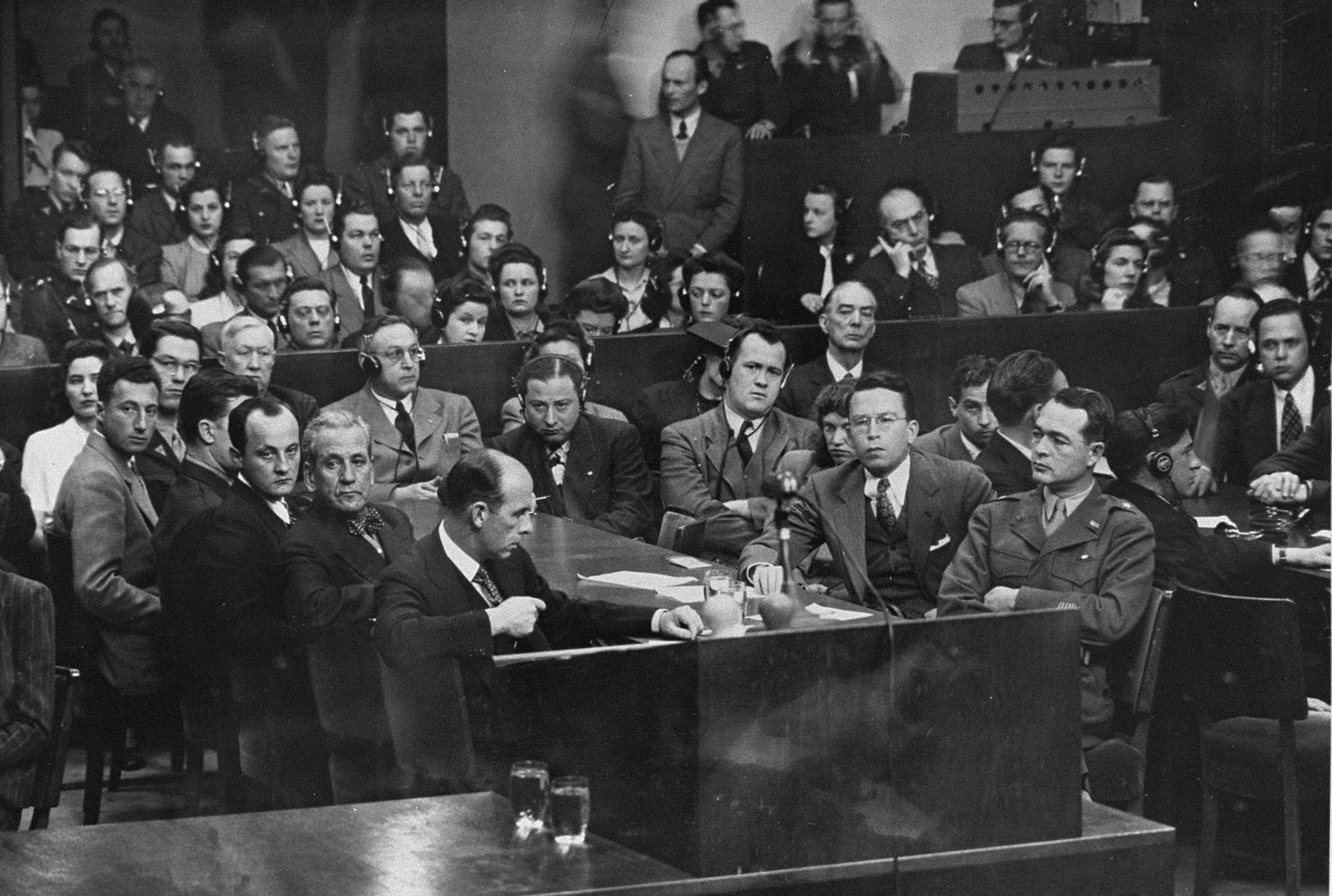 A focus on the prosecutors in a courtroom scene.