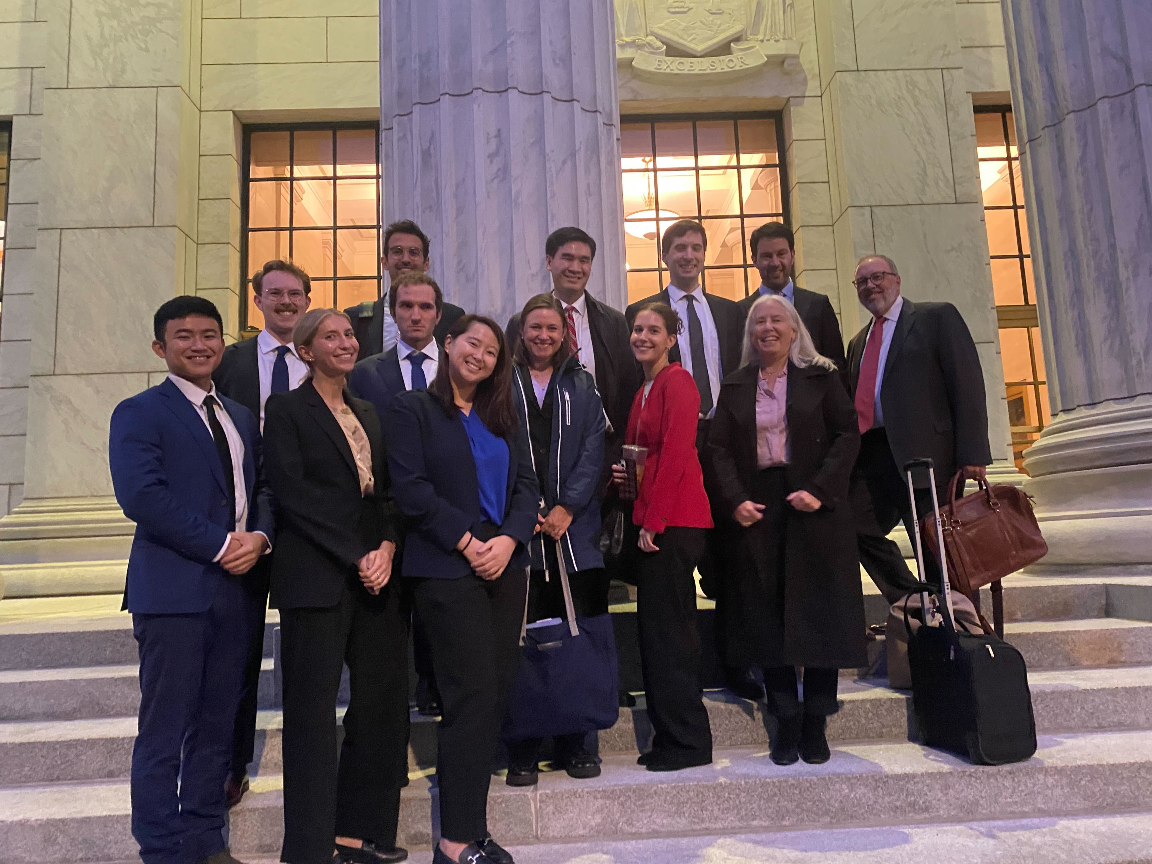 A large group stands outside the NY Court of Appeals