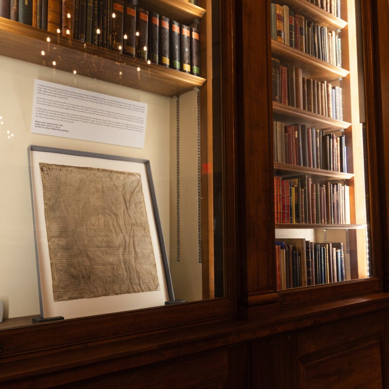 The Magna Carta on display in a case in the Langdell Library.
