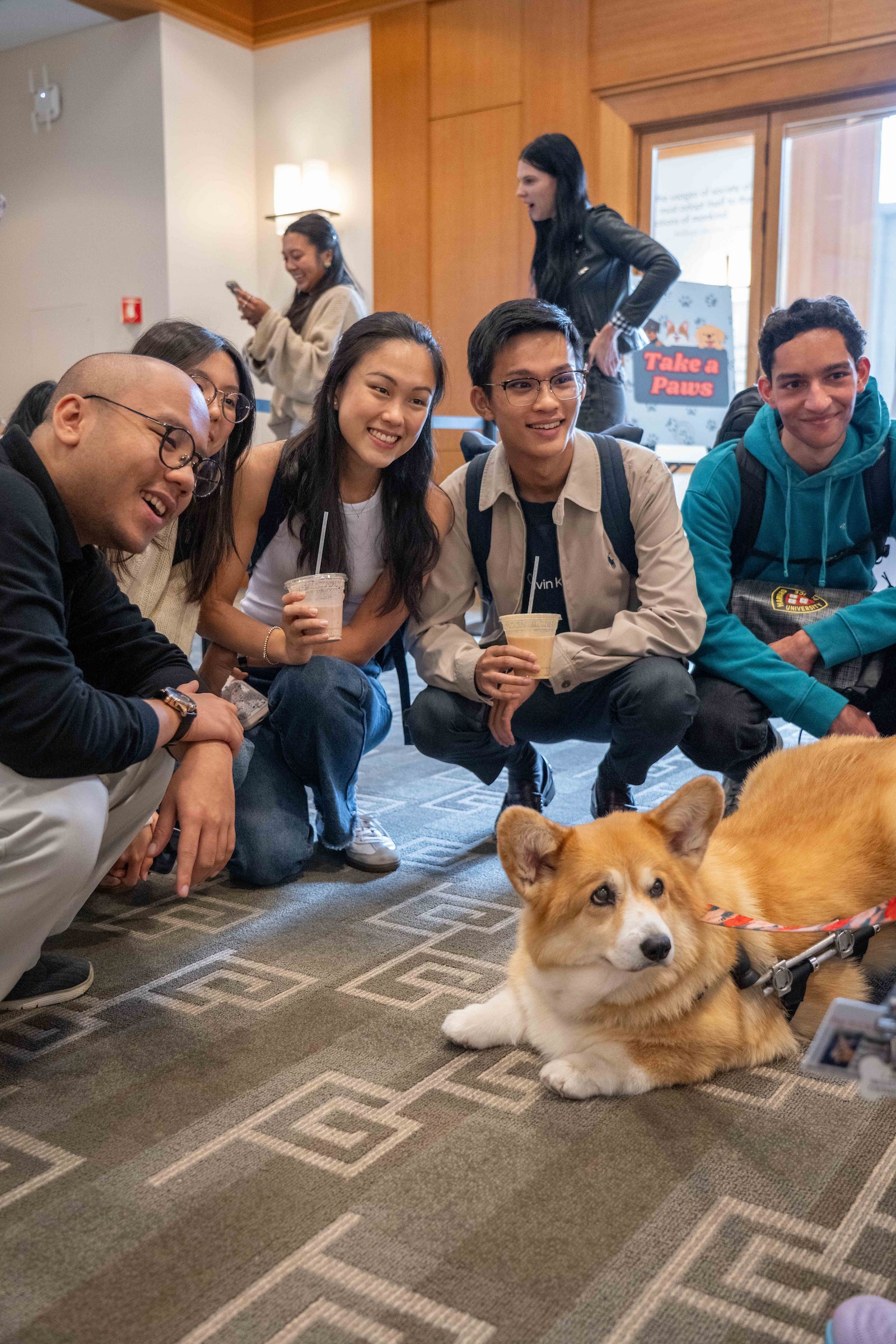 Students pose with a therapy dog.