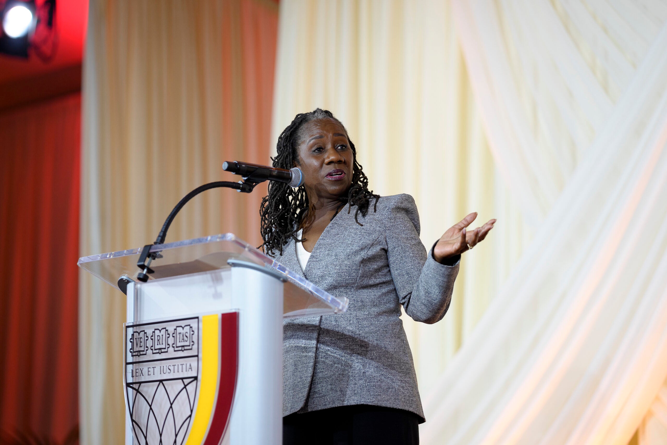 A woman speaking at a podium