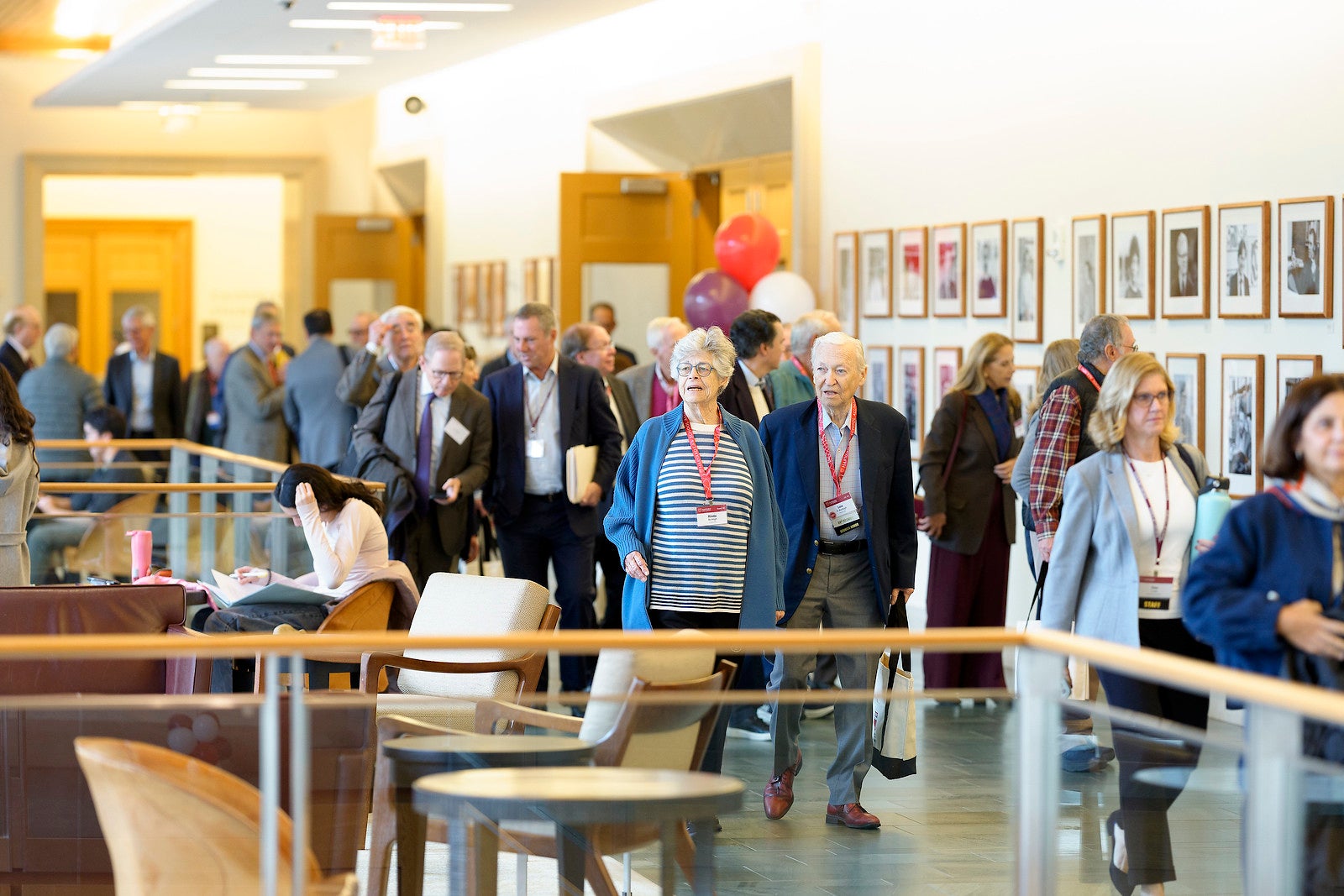 A group of people walking in the corridor of the WCC