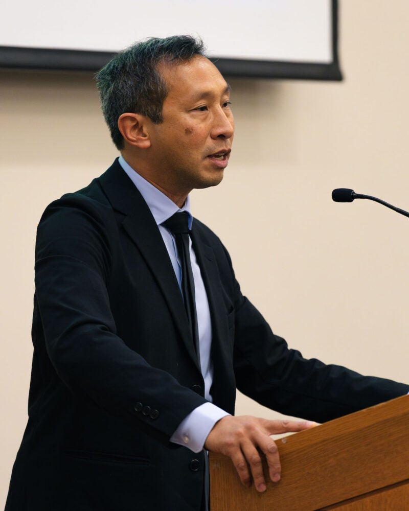 Mark Wu at the lectern.