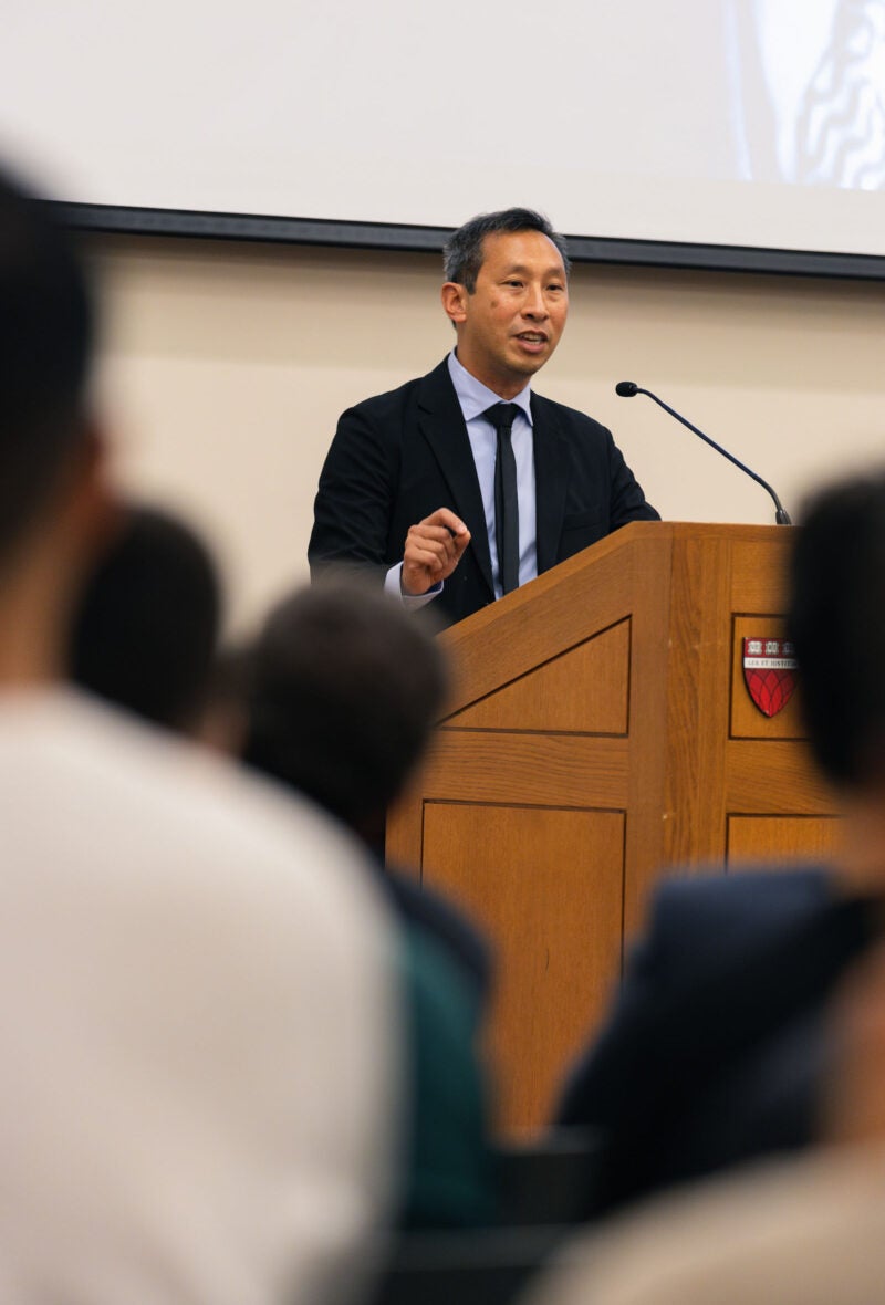 Mark Wu at the lectern.
