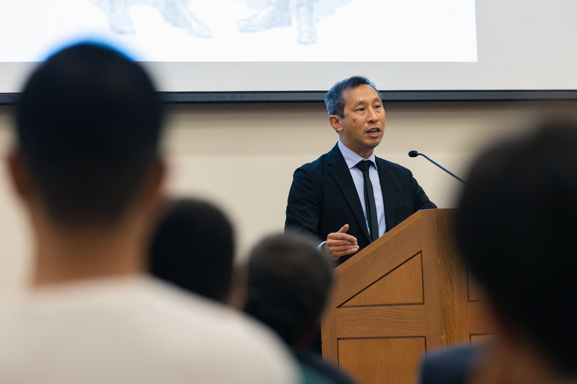 Mark Wu at the lectern.
