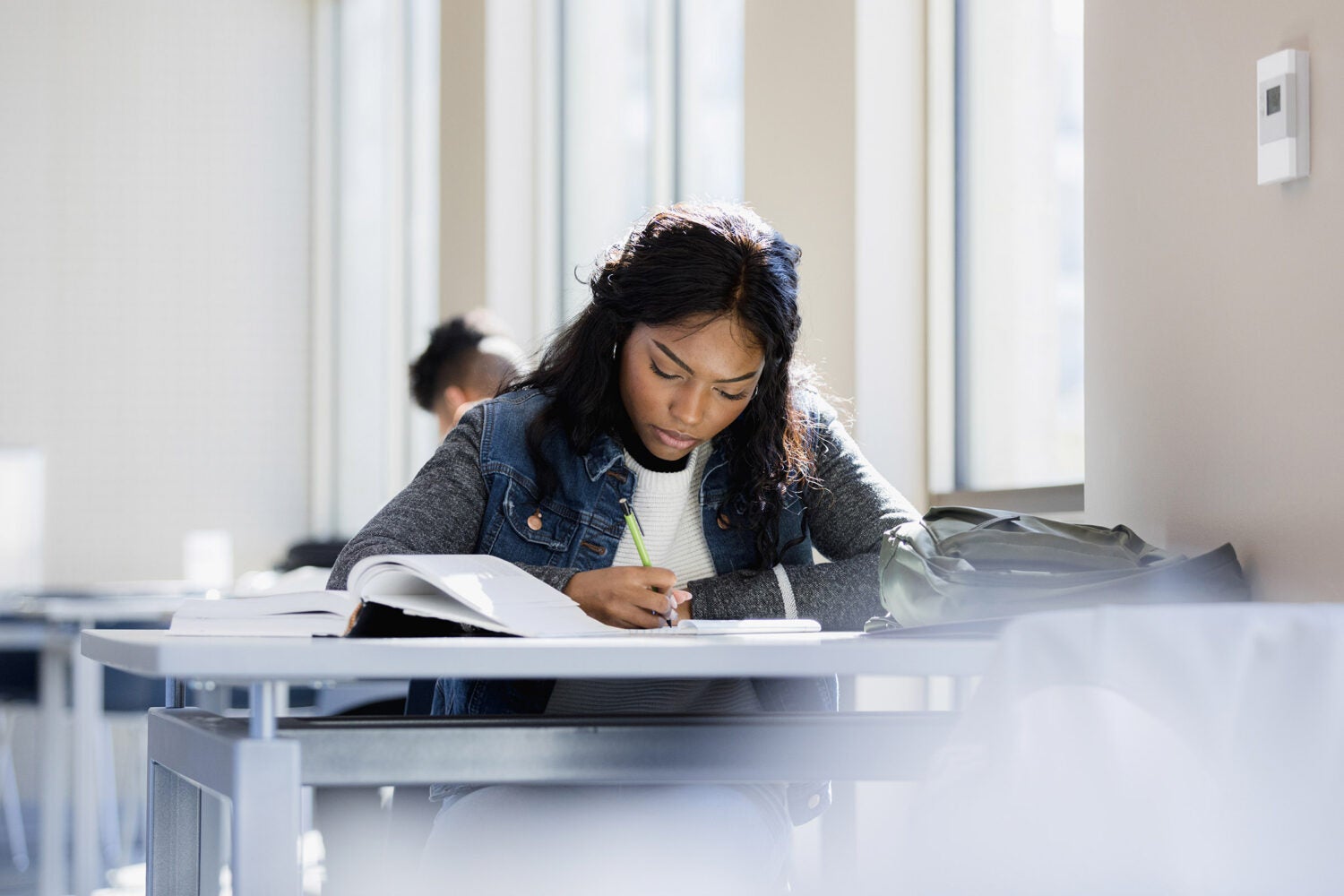 A young woman studying.