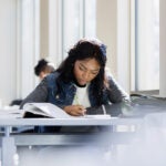 A young woman studying.