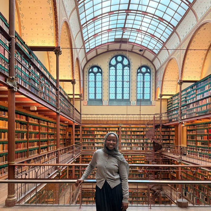 Toibat Ayankunbi in a large library in Amsterdam.
