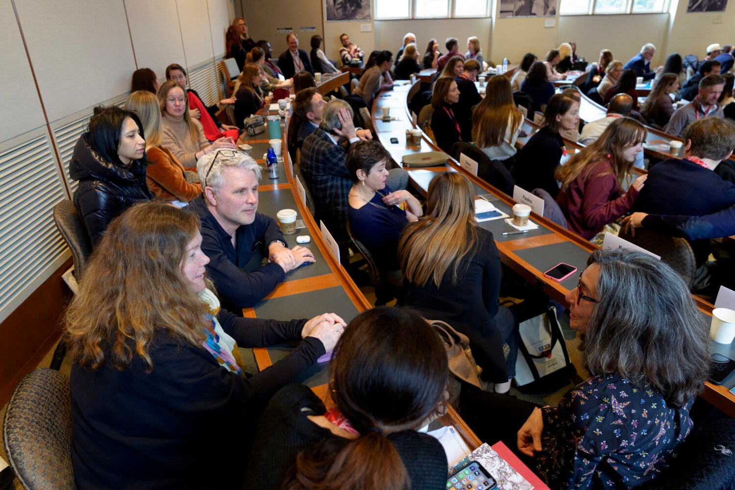 Alumni sitting down for a lecture
