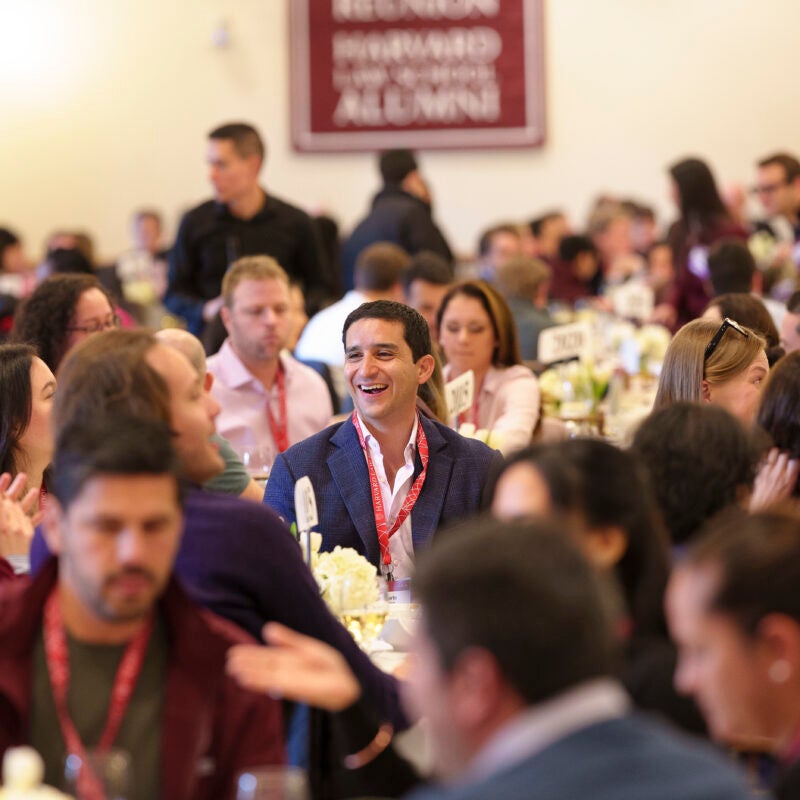 Alumni sitting down together and chatting