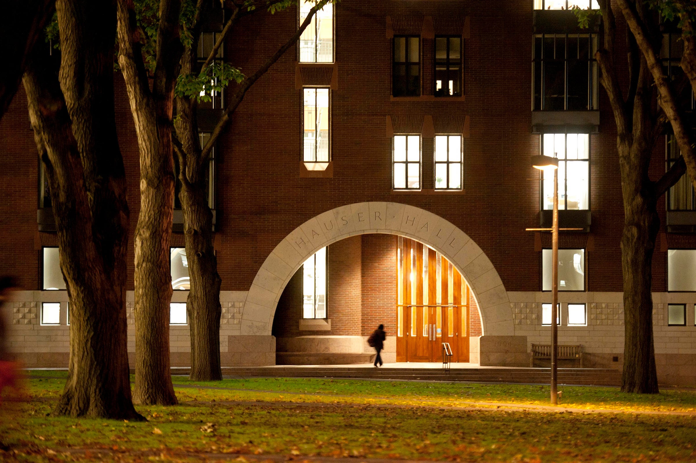 The archway entrance of Hauser Hall in early evening.