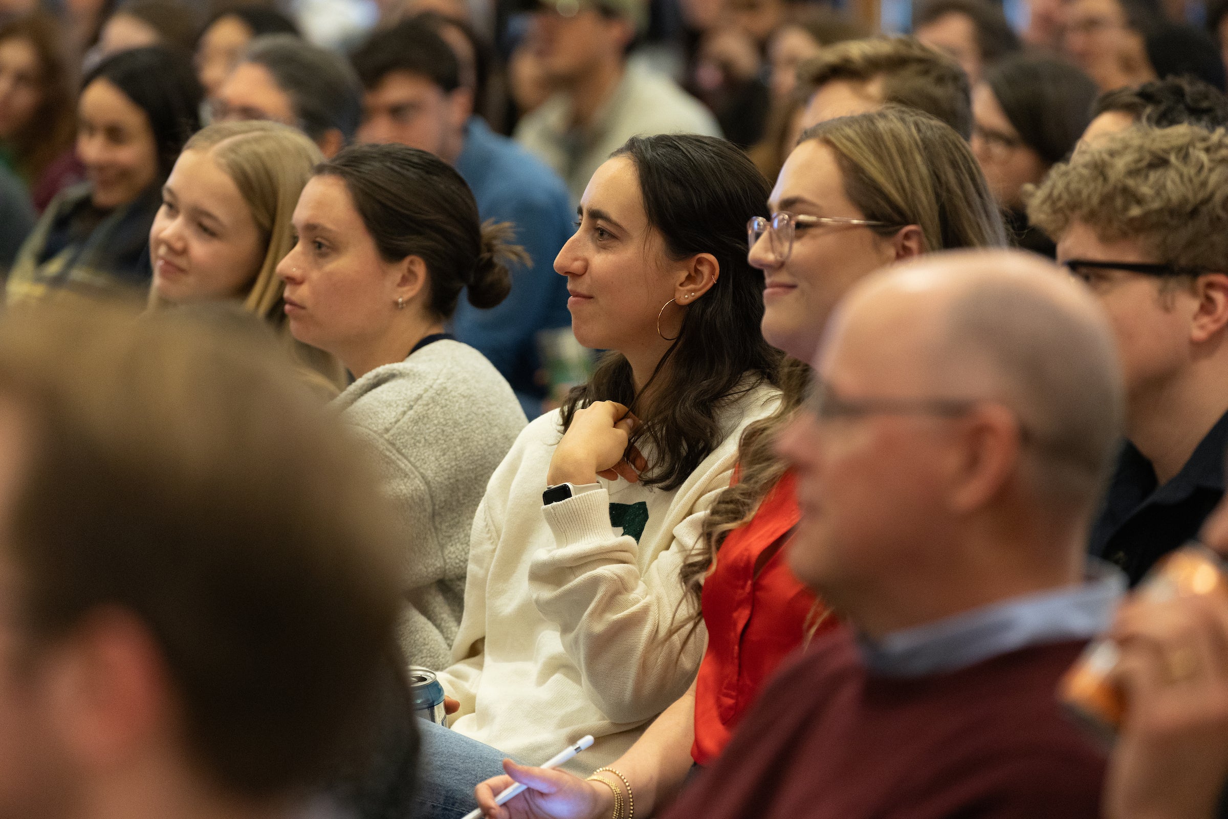 Audience members listen to a conversation between Jack Smith and Alex Whiting.