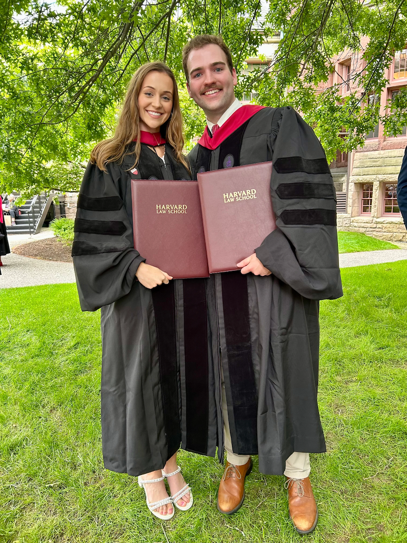 Robert and Caroline on commencement holding diplomas.