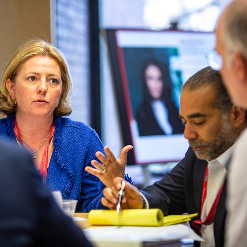 Participants meeting in a group during Executive Education program.