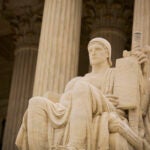 Detail of Authority of Law statue outside the U.S. Supreme Court building.