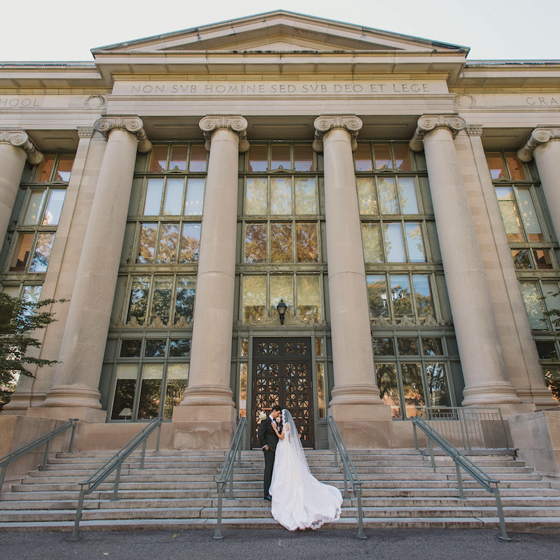 Bride and groom on steps of Langdell.
