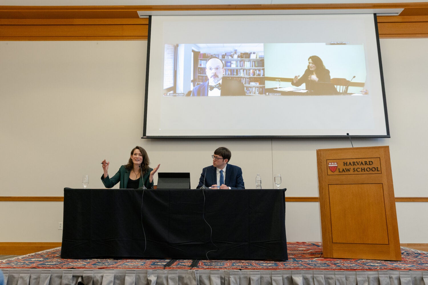 Kate Shaw speaks while Richard Re and Jonathan Adler (via Zoom) listen.