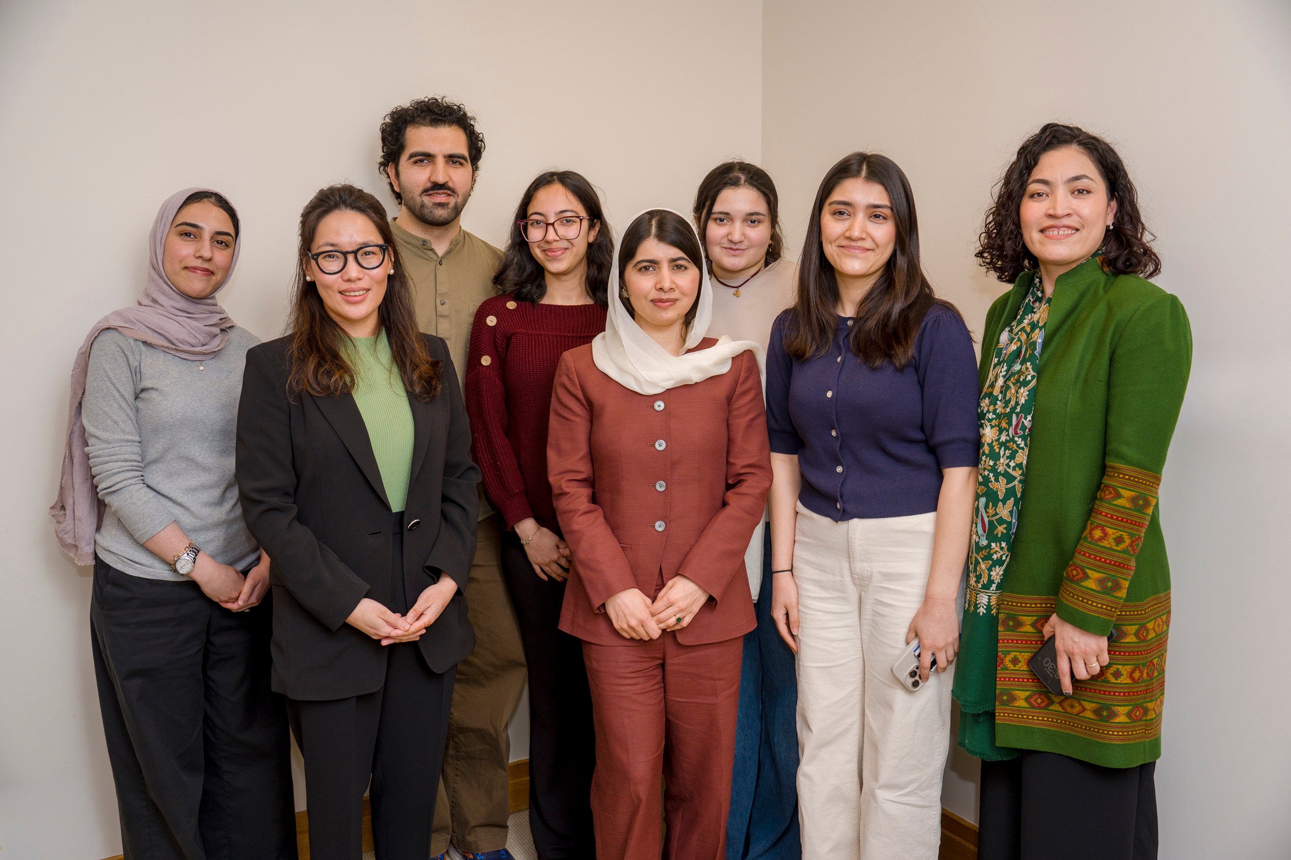 Malala Yousafzai poses with a group including discussion moderator Gaisu Yari.