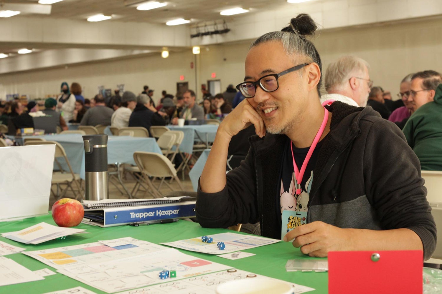 Gene Koo testing a prototype of a biography game