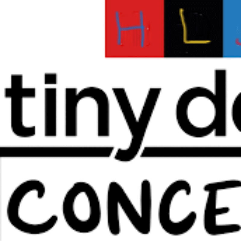 Words tiny desk on top of a desk outline with concert beneath