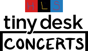 Words tiny desk on top of a desk outline with concert beneath