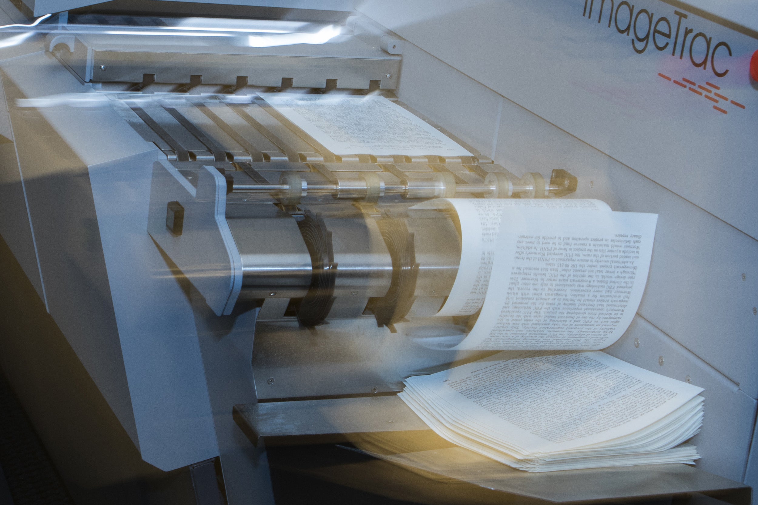 A machine that digitizes documents in action.