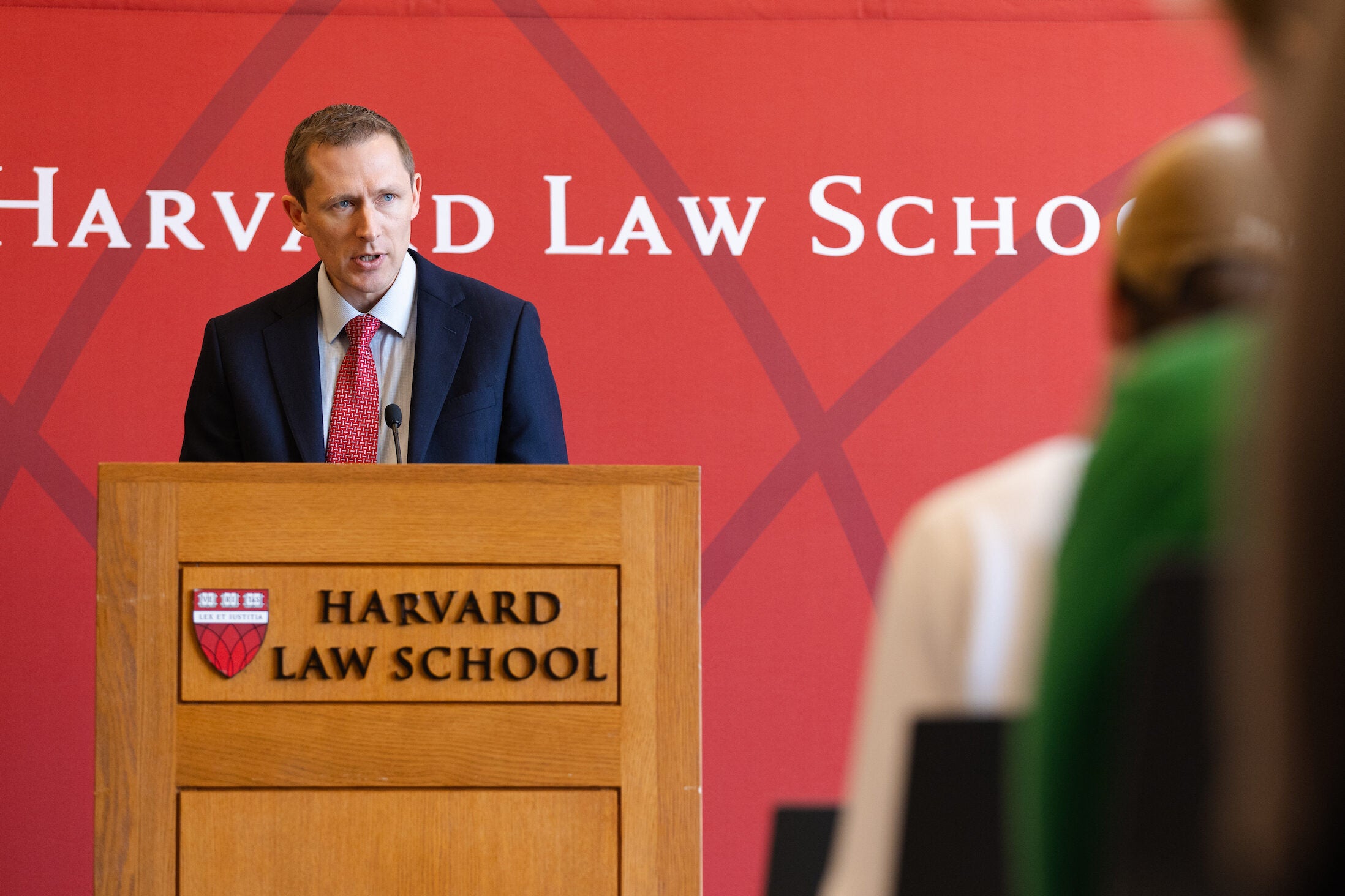 Richard Ekins speaking at a podium