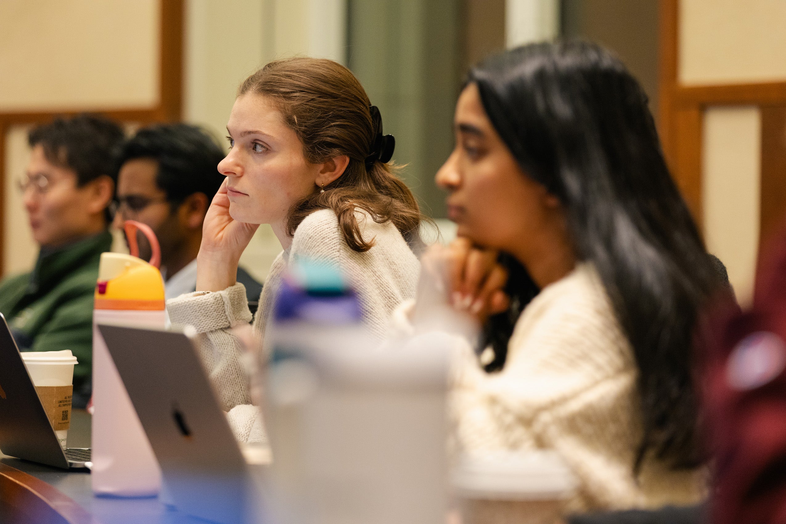 Students listening in a classroom.