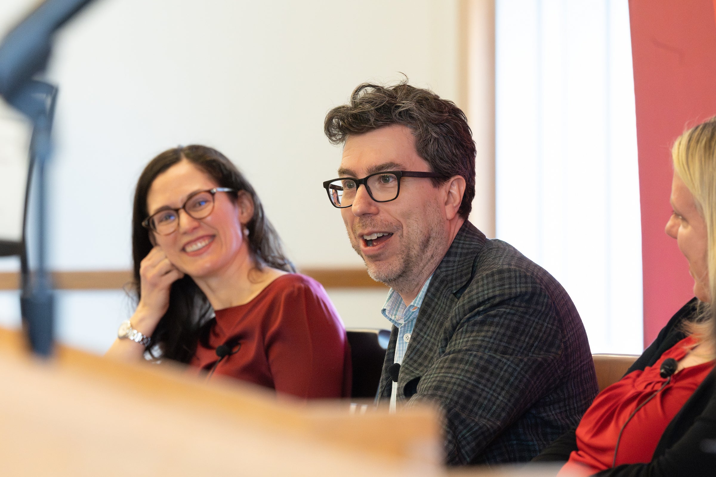 Jonathan Zittrain speaking while Daphna Renan looks on.