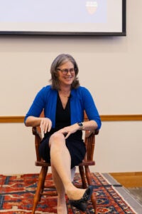 Sheila Heen sitting in the ceremonial chair.