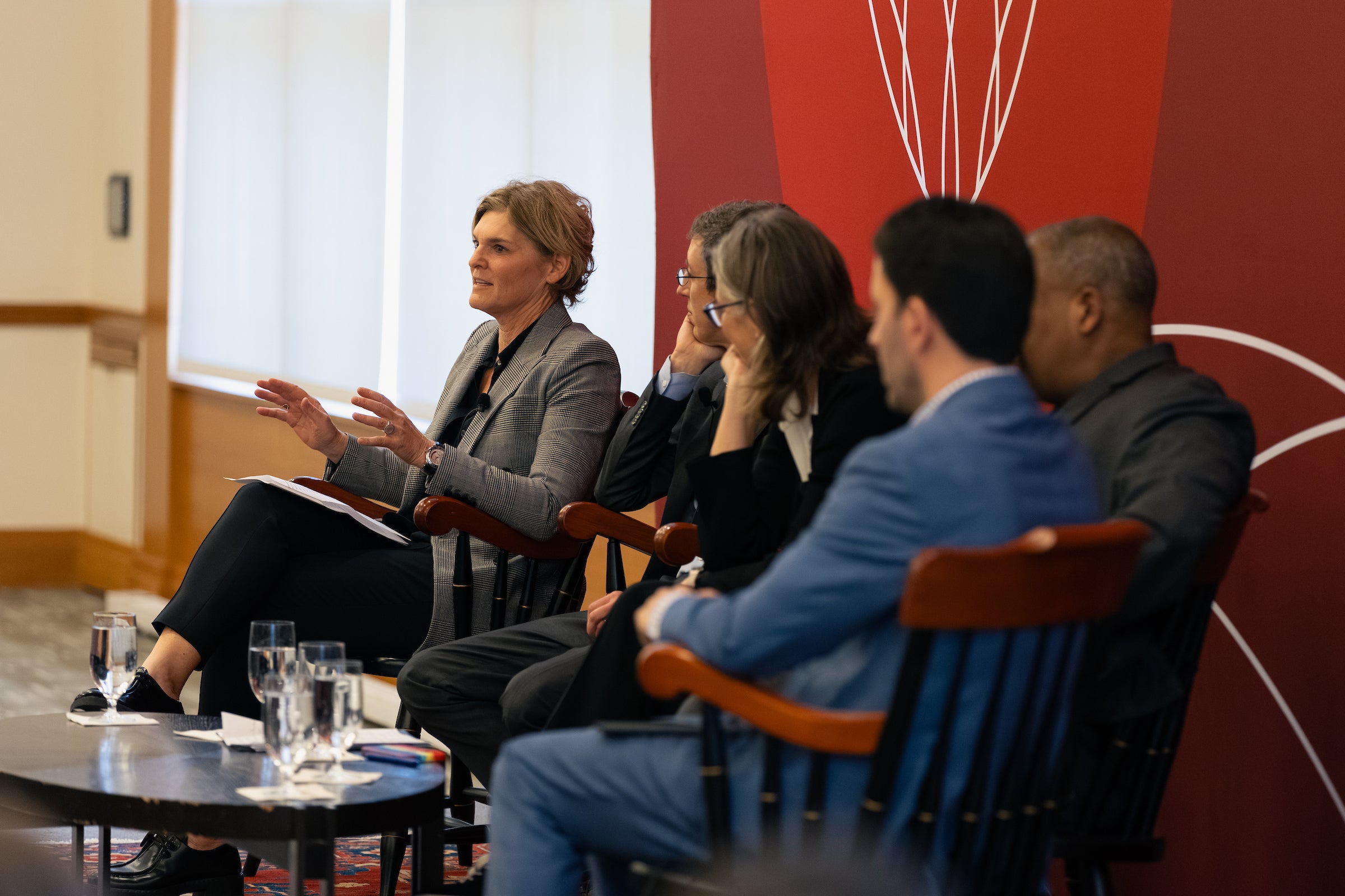 Jody Freeman talks while panelists listen.