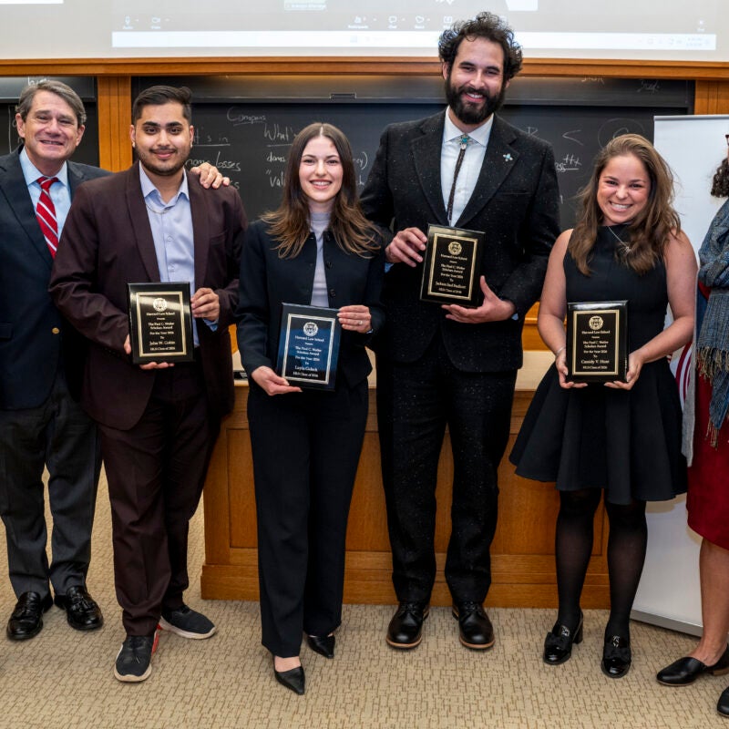 Weiler Award recipients stand holding their awards